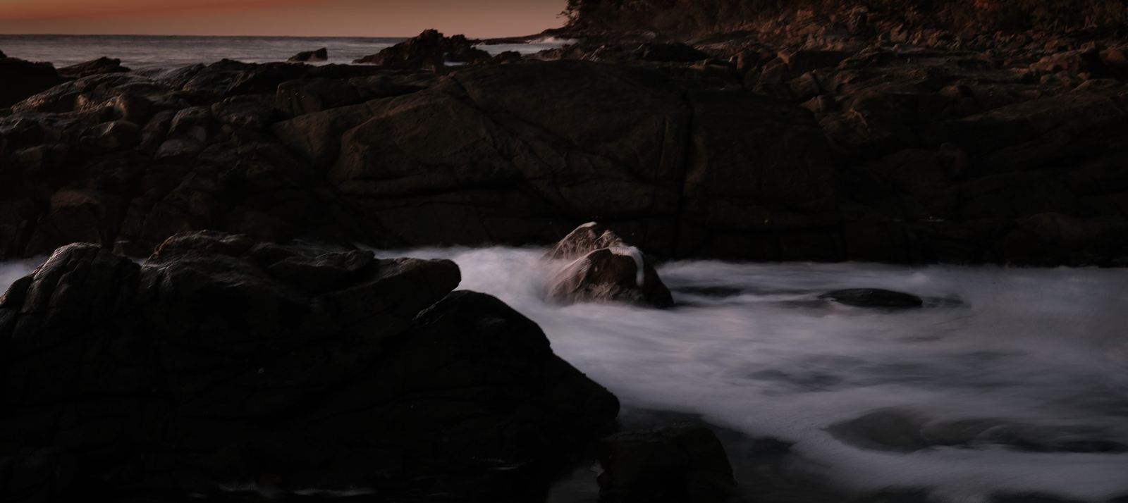 Rocks and orange sky, Coolum