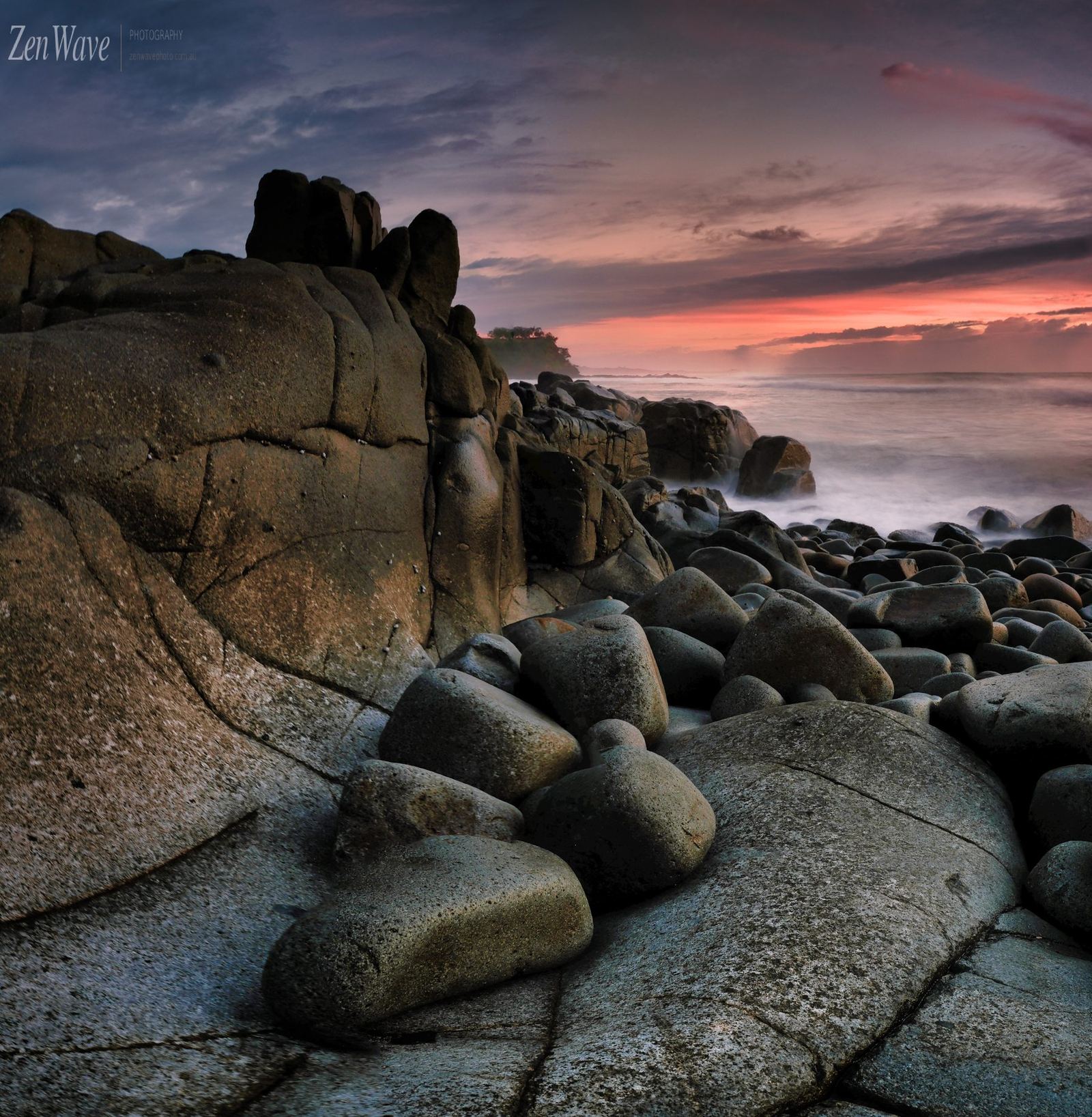 Ancient rock face, crimson horizon