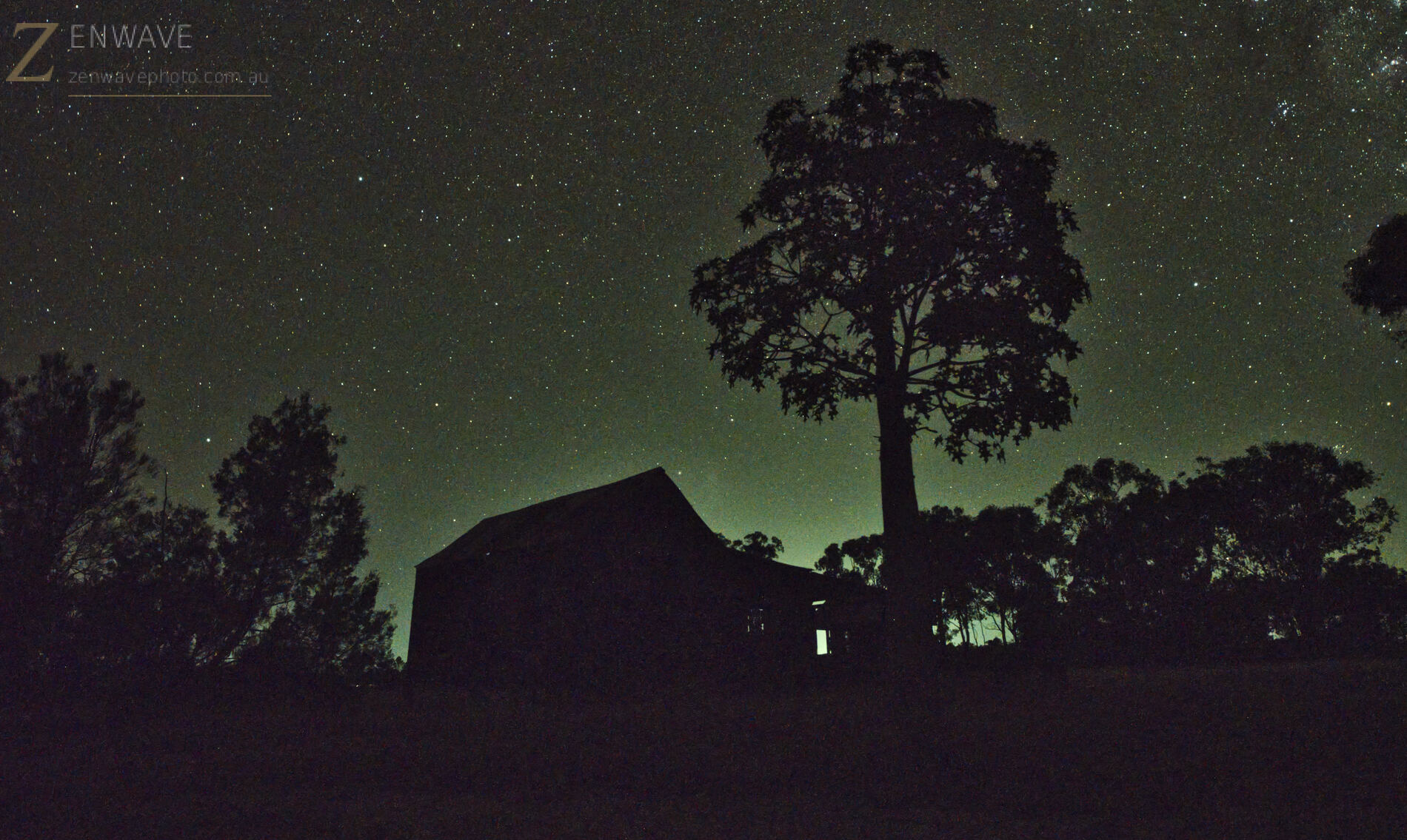 Night landscape and cabin silhouette